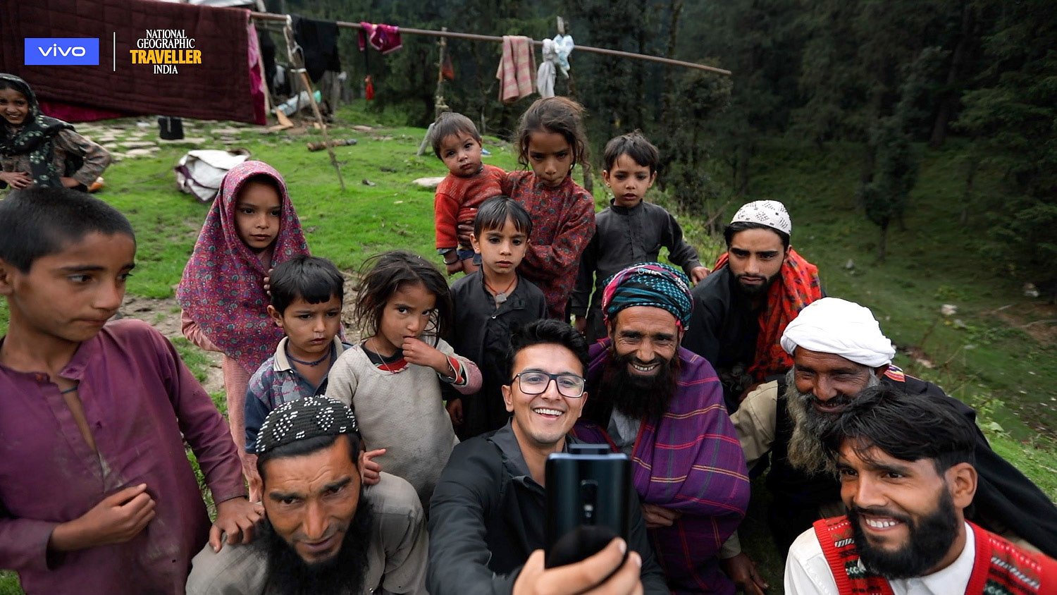 Himanshu Khagta taking a photograph with a local family in the vivo V17 Pro film